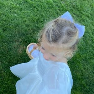 Flower girl Dress is white. I have couple sizes available. Size 2t, 3-4T, 5-6T